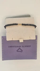 18 Carat Gold Beaded Charm Bracelet