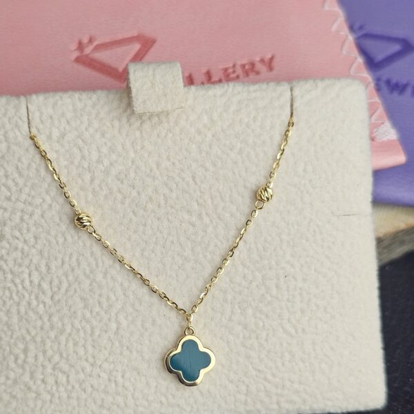 Elaria 18K gold clover necklace with green stone pendant on delicate chain
