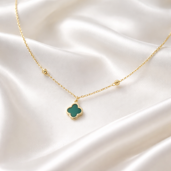 Elaria 18K gold clover necklace with green stone pendant on delicate chain