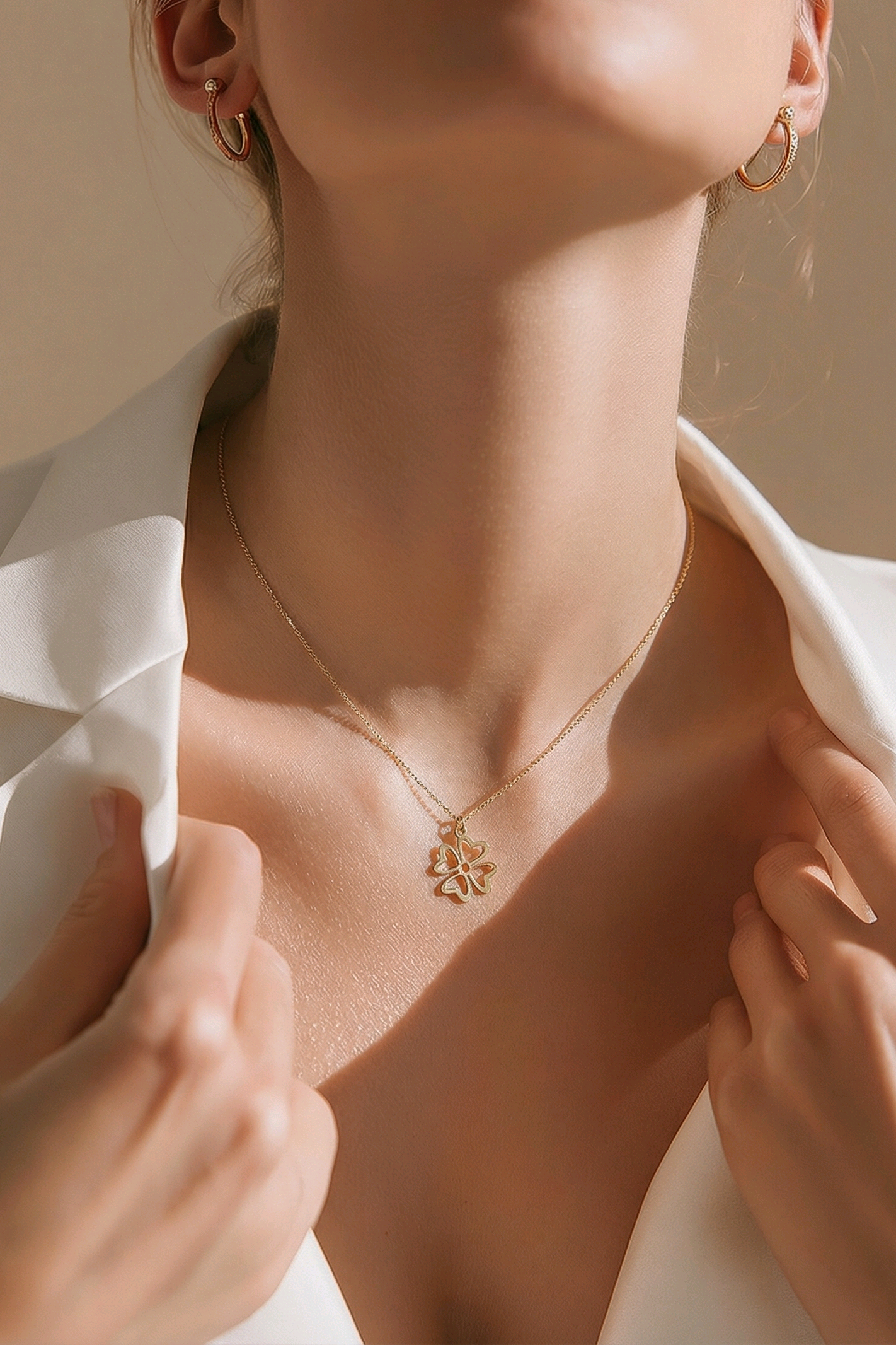 Floréa 18K gold charm necklace with delicate floral pendant on fine chain